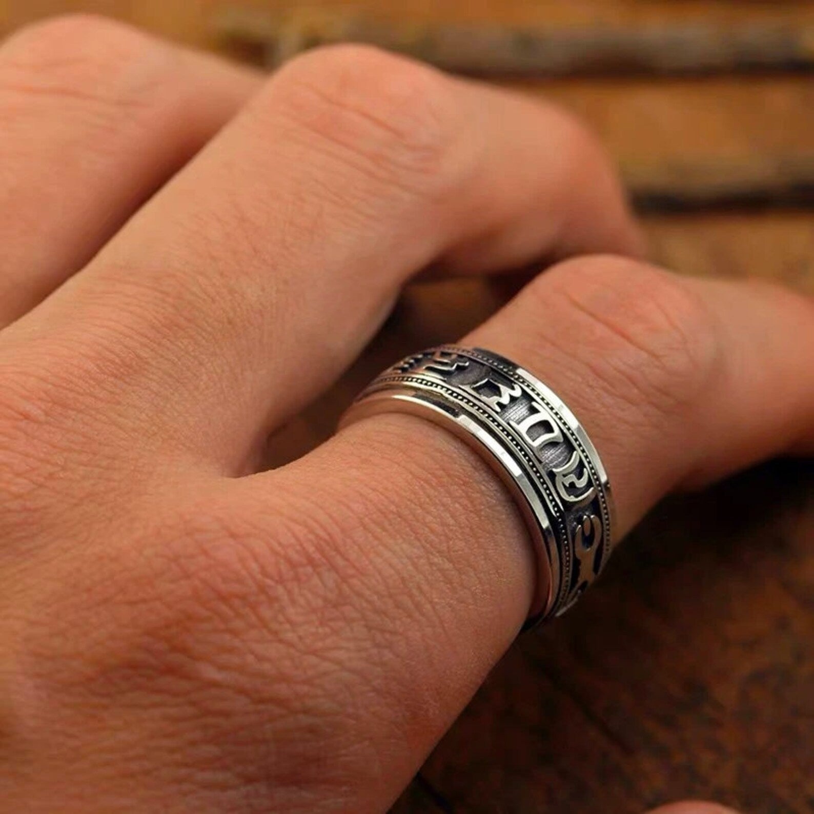 buddhist spinner ring on hand during meditation