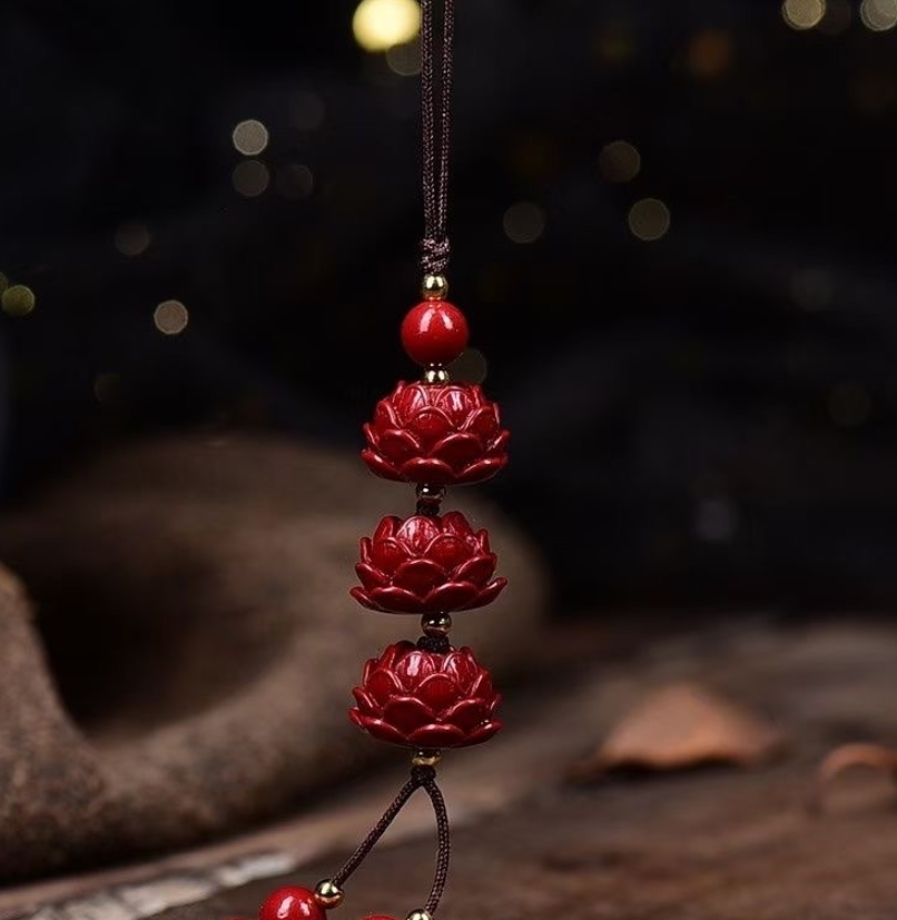 cinnabar lotus phone charm