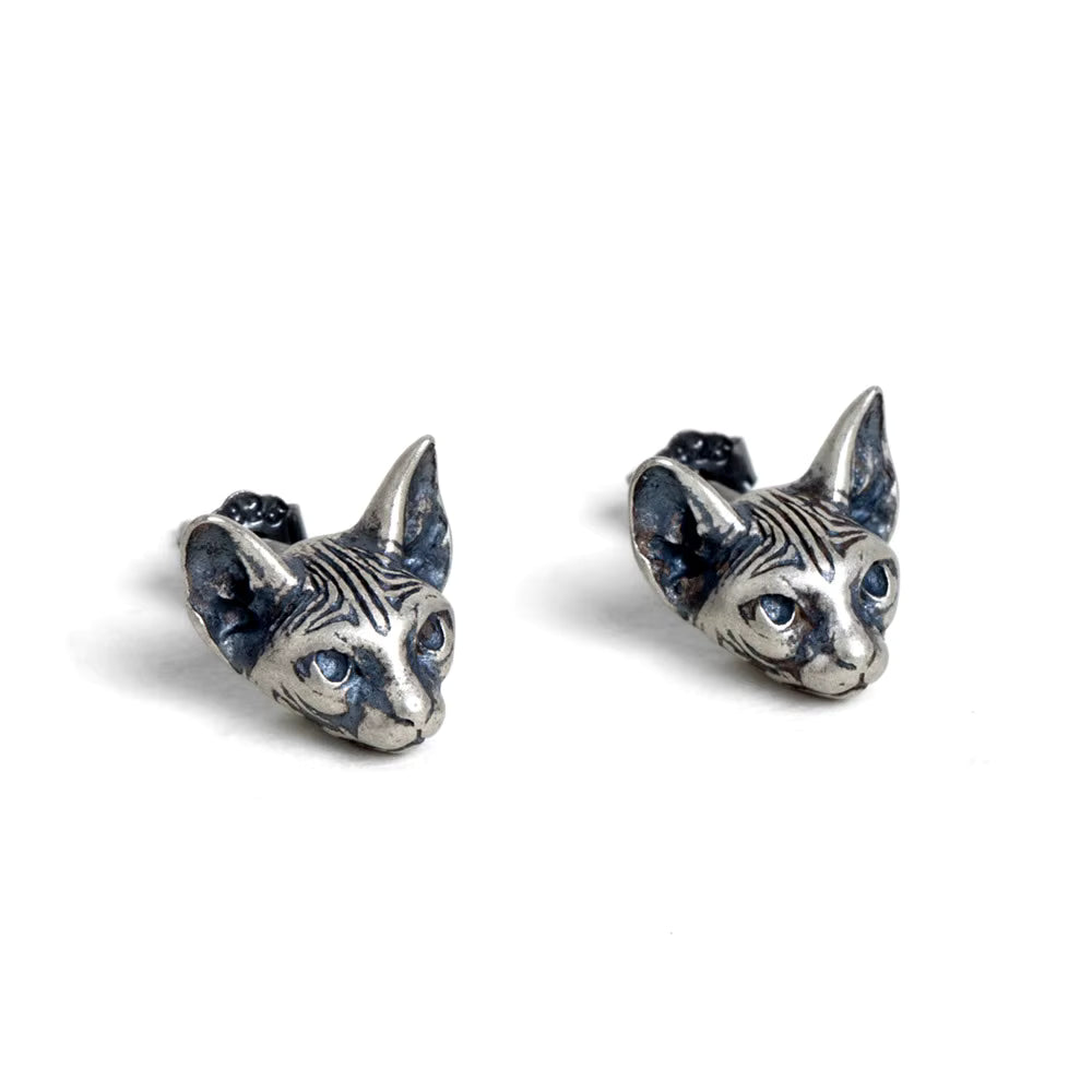 detailed cat face earrings side angle white background