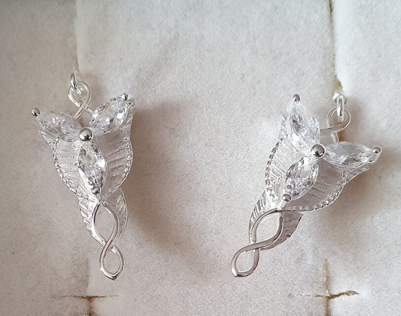 evenstar lord of the rings earrings on white background
