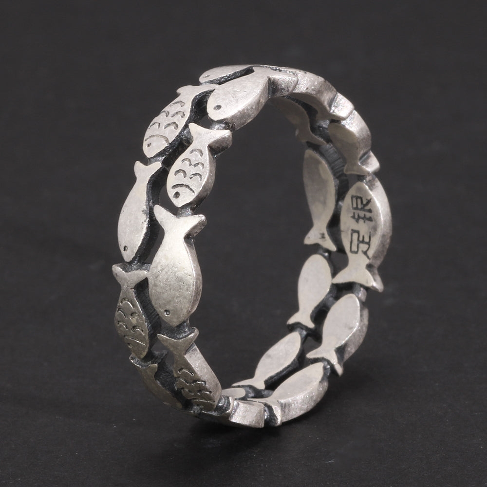 Unique symbolic fish ring in loop design