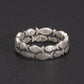 Oxidized silver ring with Asian-style character engravings