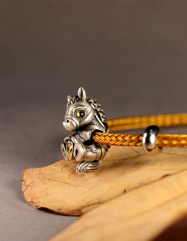 gold crystal accent silver horse charm on rope bracelet