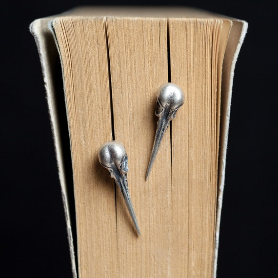 gothic hummingbird skull earrings top view