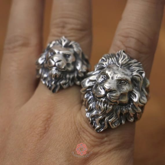 handcrafted lion ring details on man's finger