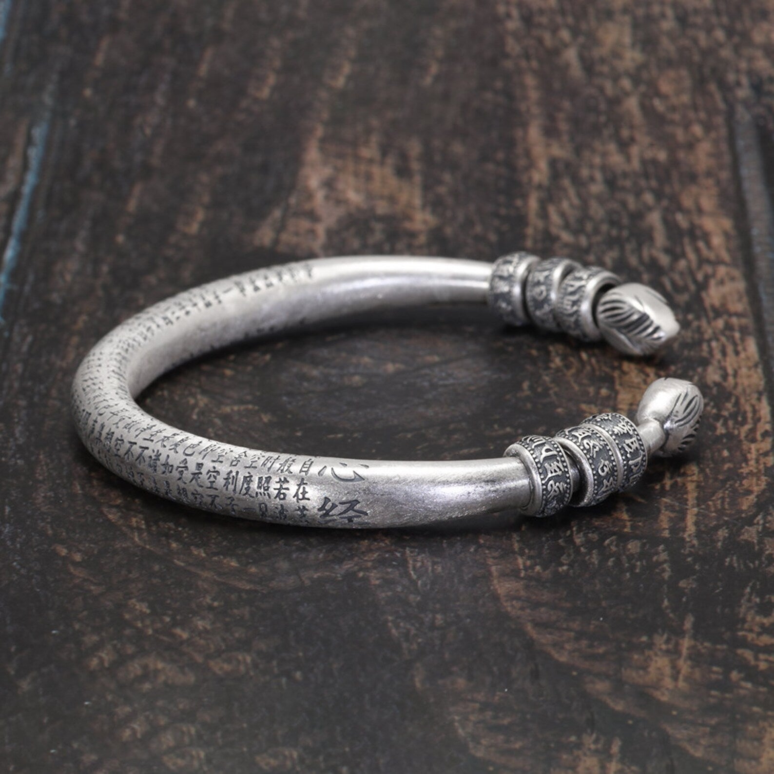 heart sutra bracelet on wooden background