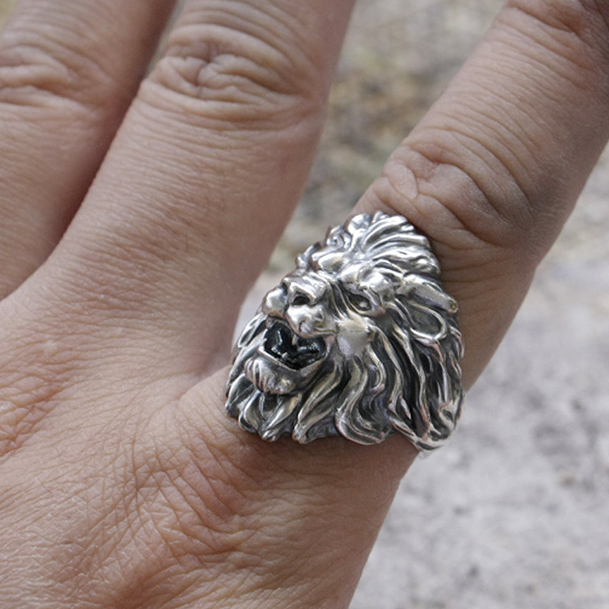 lion ring on finger