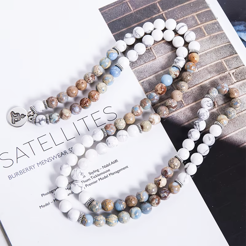 mala necklace flat lay