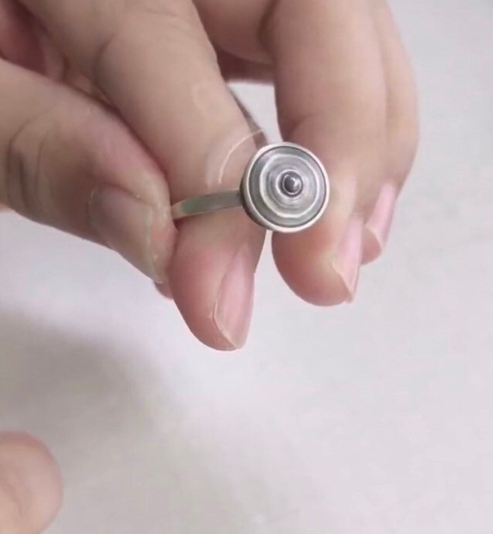 meditation spinner ring on finger demonstrating movement