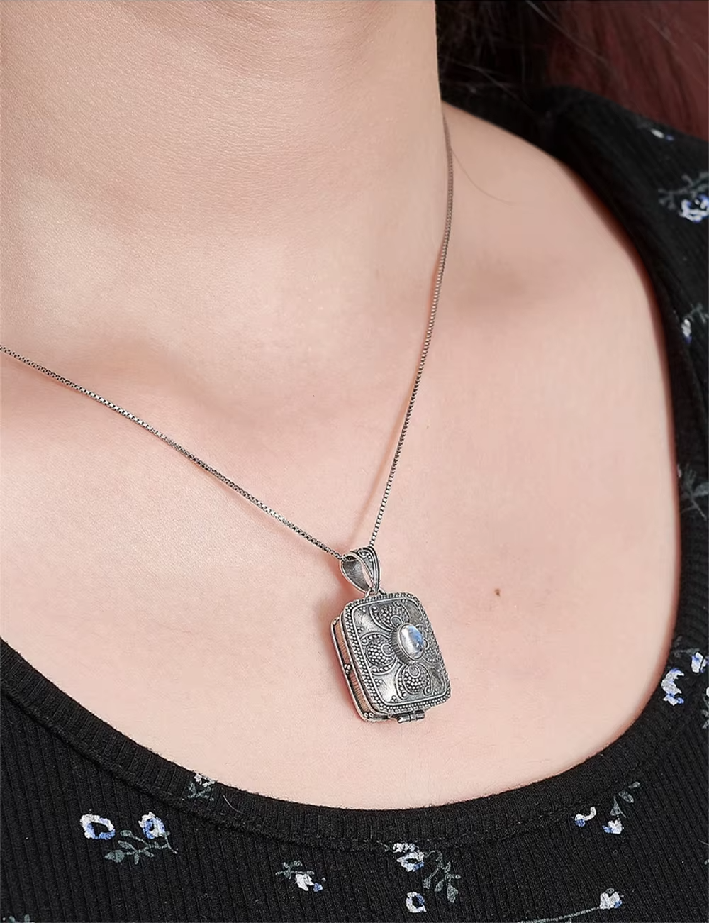 moonstone locket pendant worn on woman neck