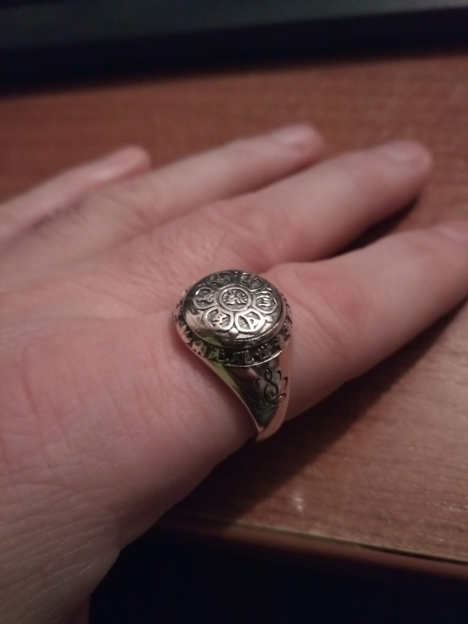 om ring man's finger