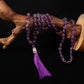 purple crystal prayer beads on display