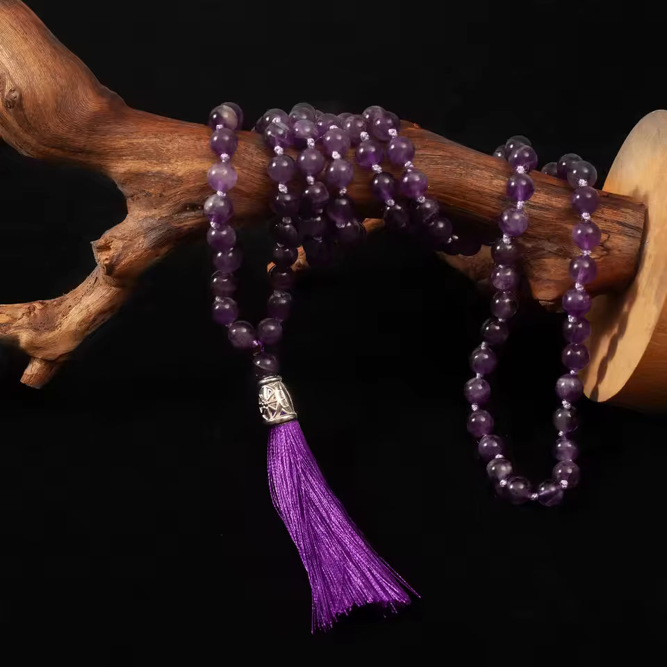 purple crystal prayer beads on display