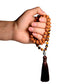 rudraksha mala wrapped around hand for display
