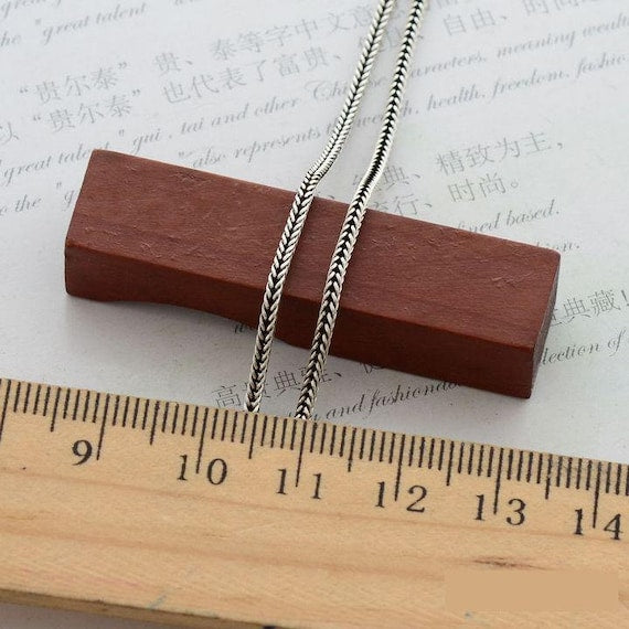 Silver foxtail chain necklace display