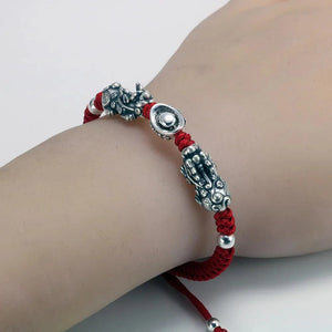 Sterling silver Pixiu charm on model