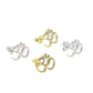 silver and gold plated om symbol studs displayed on surface