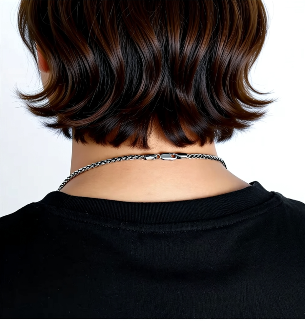 silver chain on man back view