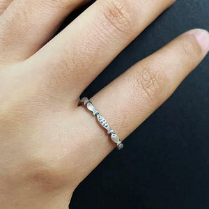 silver fish band ring on finger