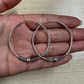 silver large hoop earrings on hand