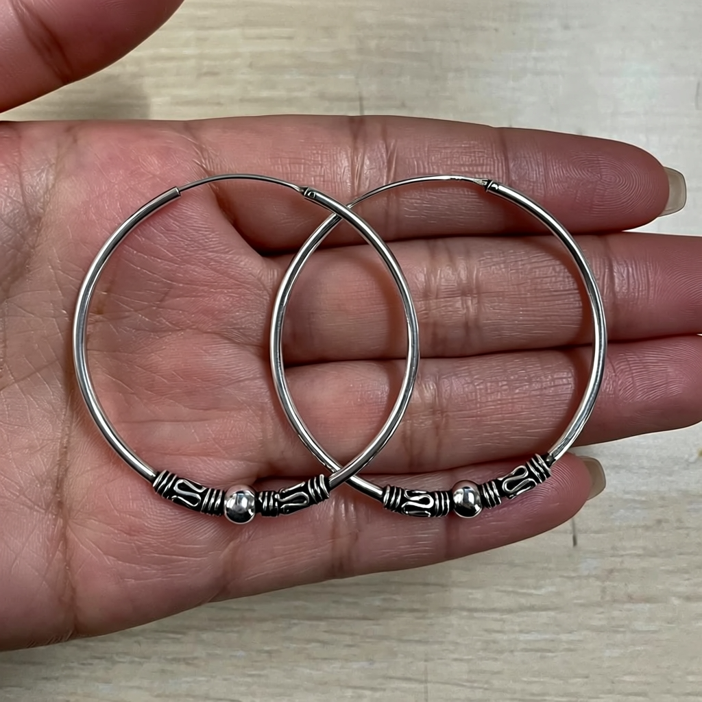 silver large hoop earrings on hand
