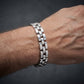 silver link bracelet on men wrist