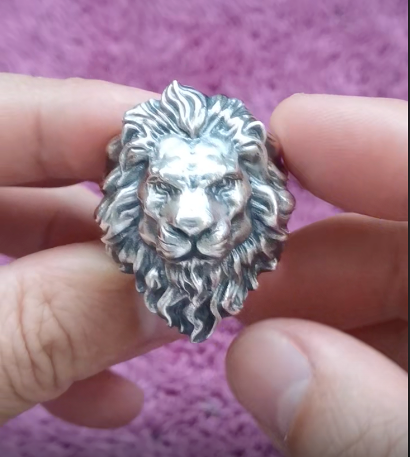 silver lion ring front view holding