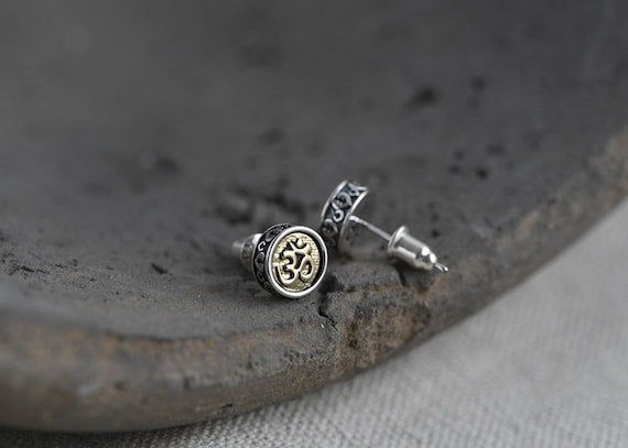 silver om stud earrings front and back view