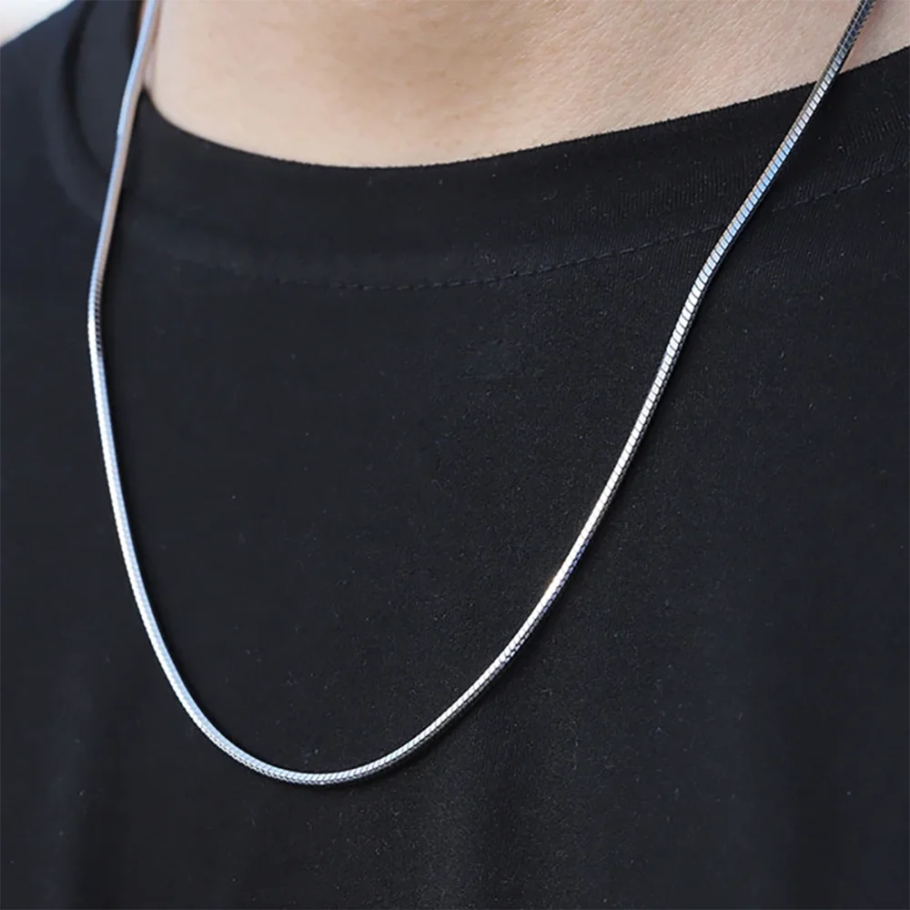 silver snake chain on neck