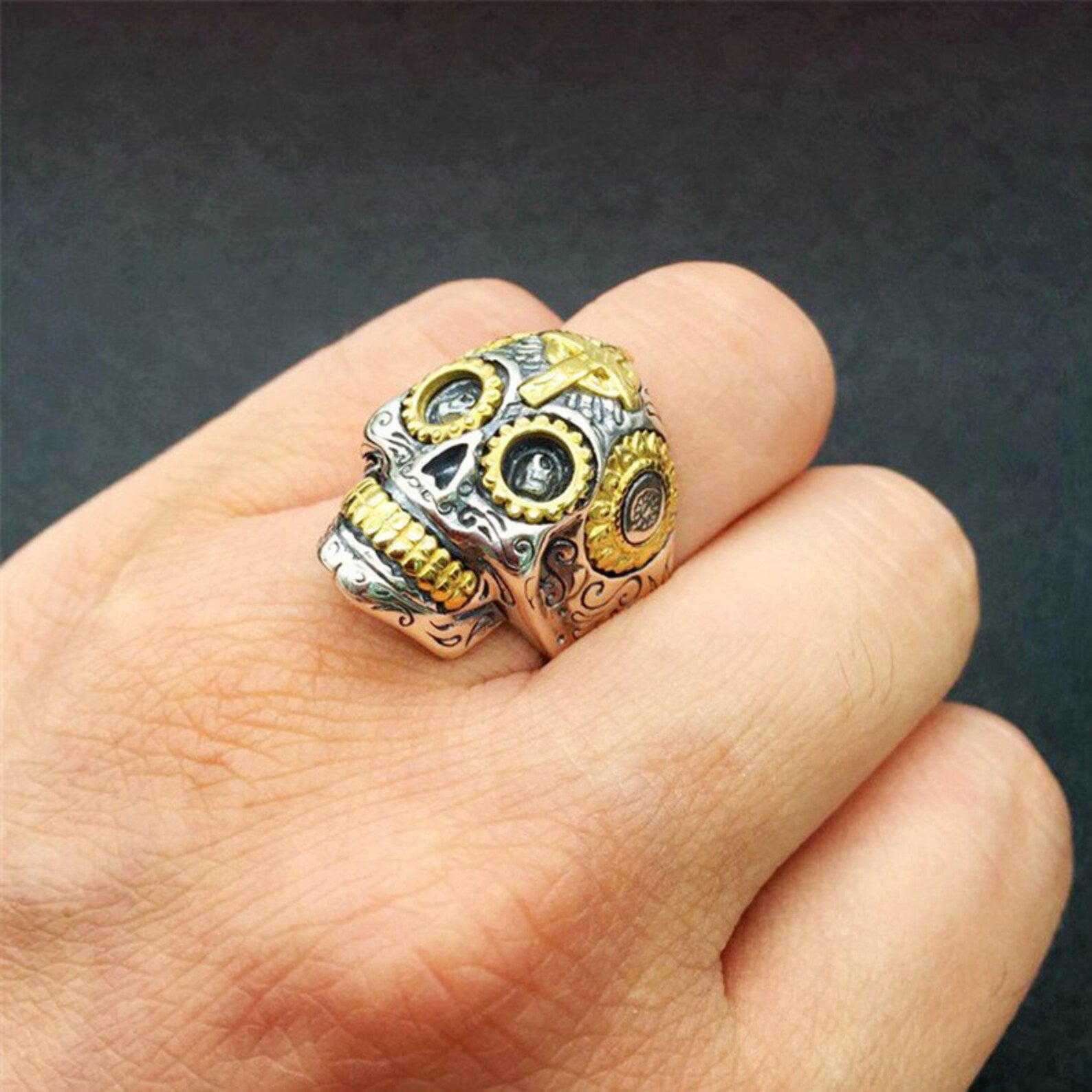 silver sugar skull ring worn on finger