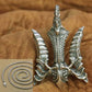 silver trident pendant with chain close up