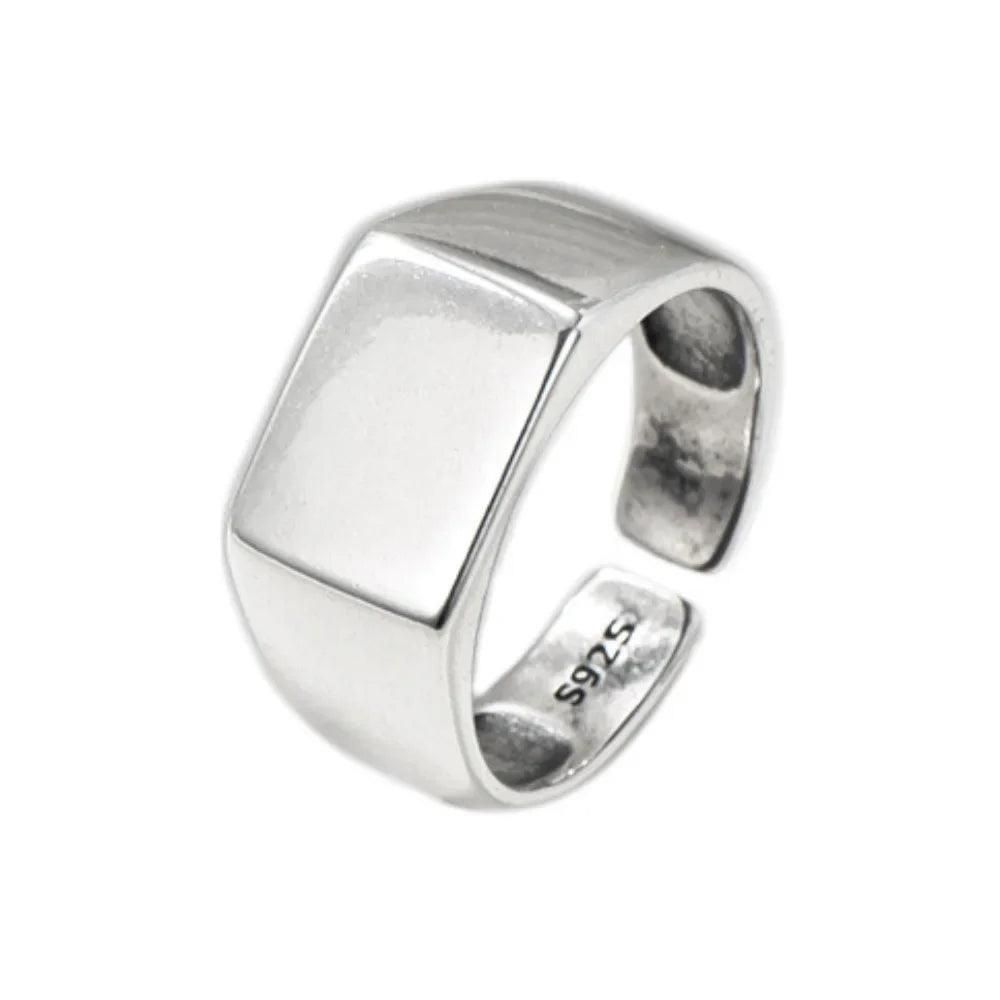 Silver ring with '925' stamp on a white background