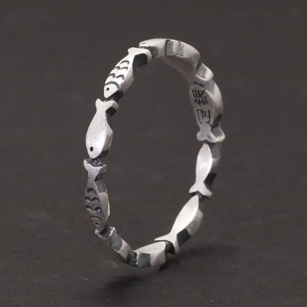stackable silver fish ring close up