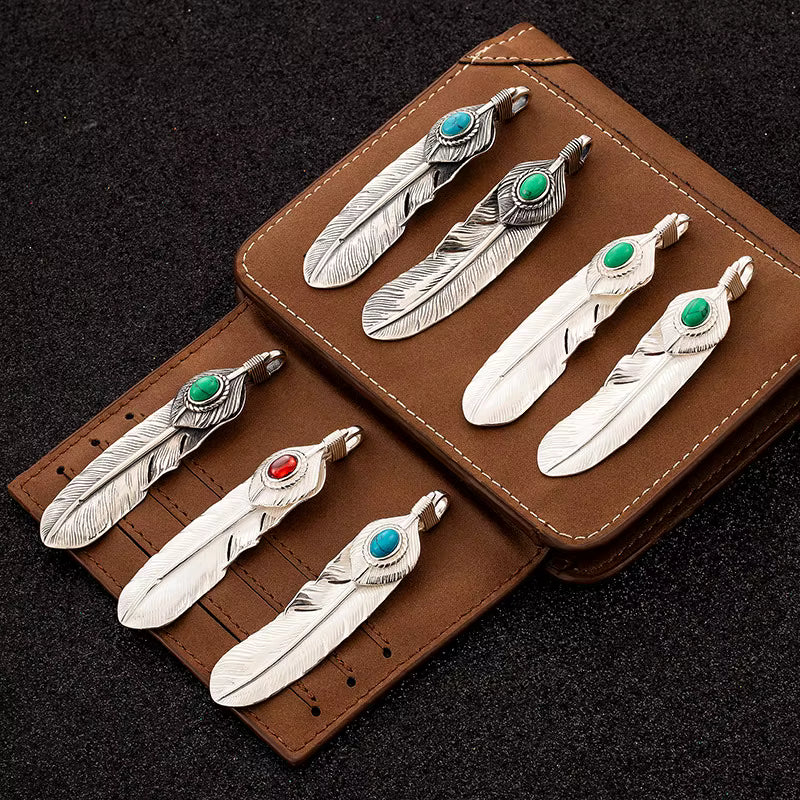sterling silver feather pendant on leather pouch