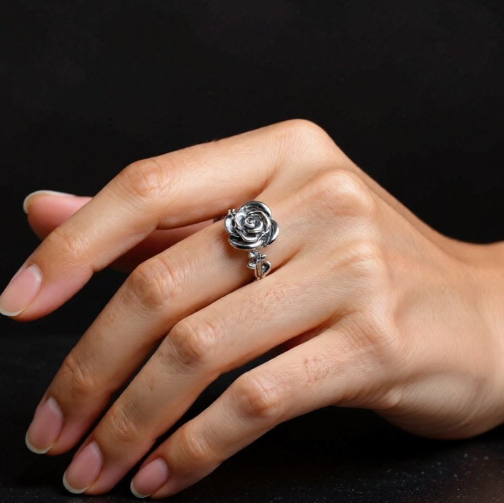 sterling silver rose ring on a model middle finger