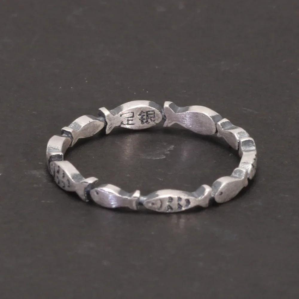 sterling silver swimming fish ring front view