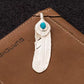 turquoise stone feather charm front view