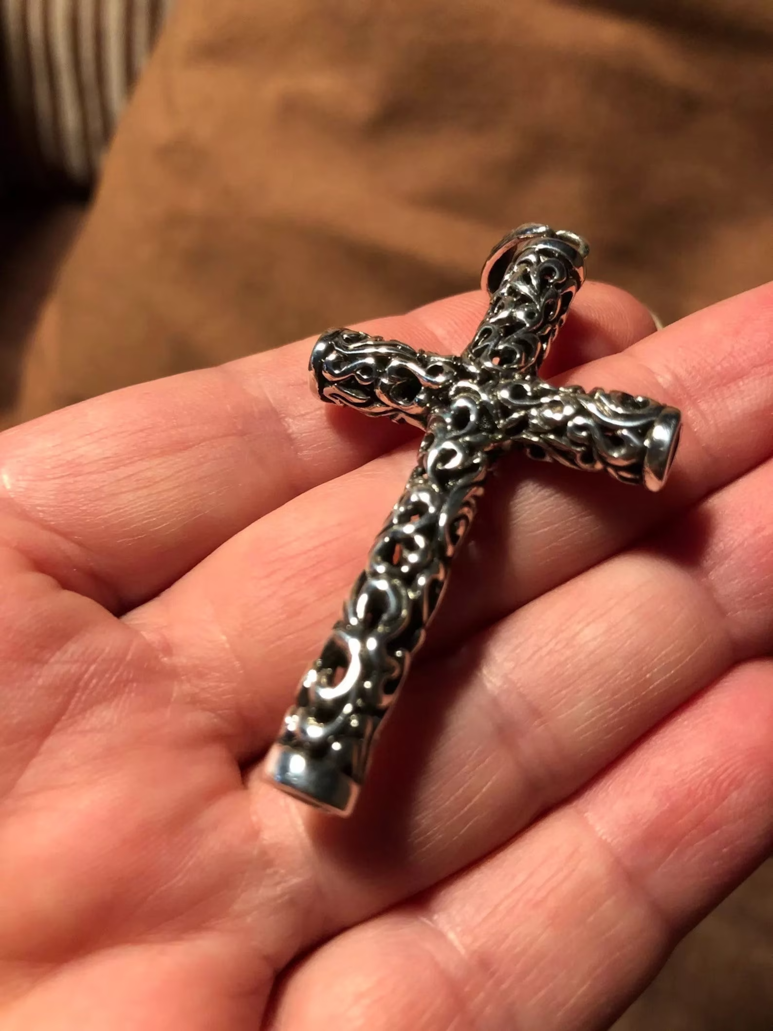 viking cross necklace front view on hand