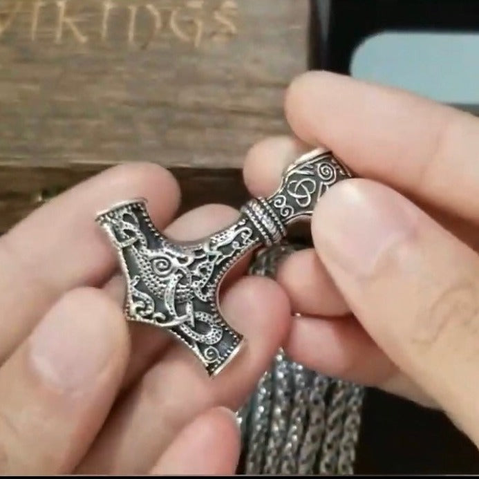 viking mjolnir pendant on hand