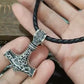 viking odin mjolnir pendant on palm