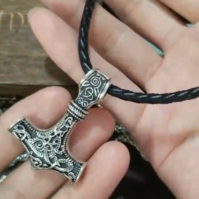 viking odin mjolnir pendant on palm