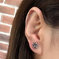 vintage spider earrings on model close up