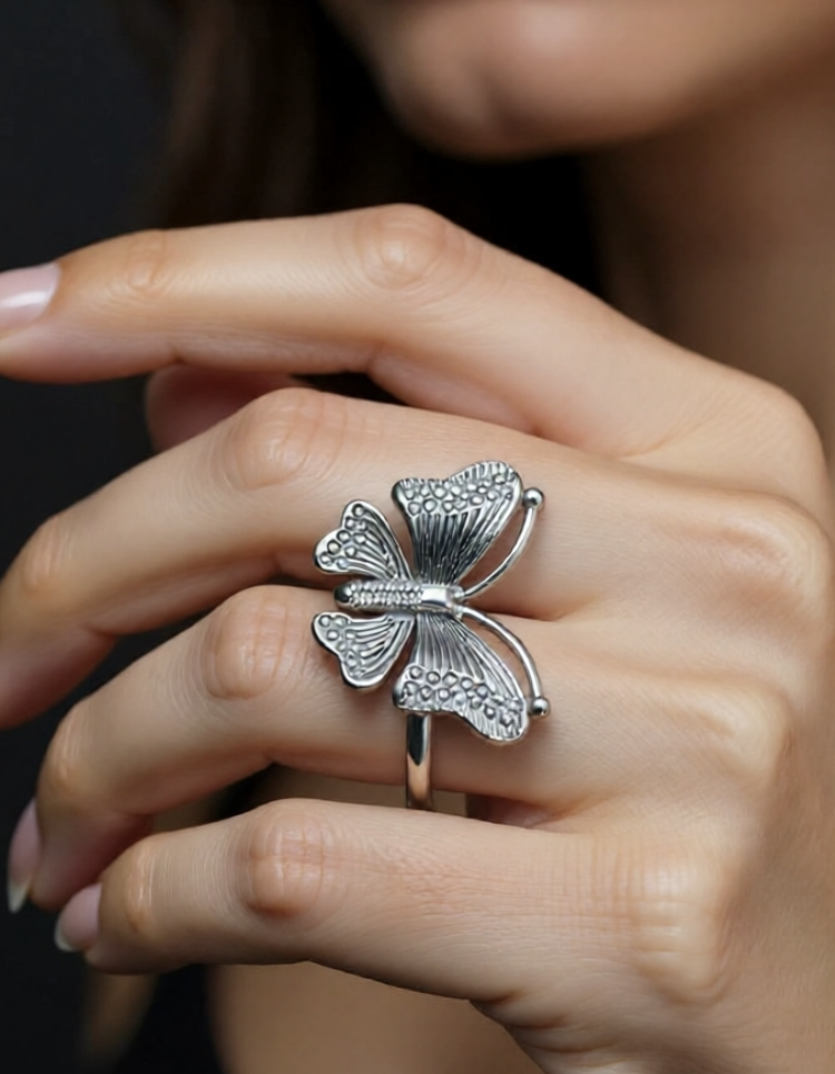 women wearing butterfly silver ring