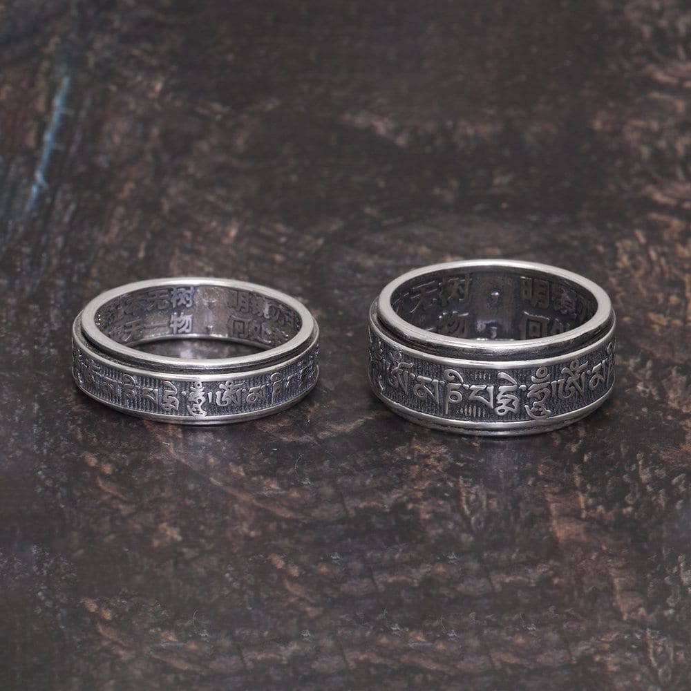 Large 10mm and small 6mm Tibetan spinner rings displayed together