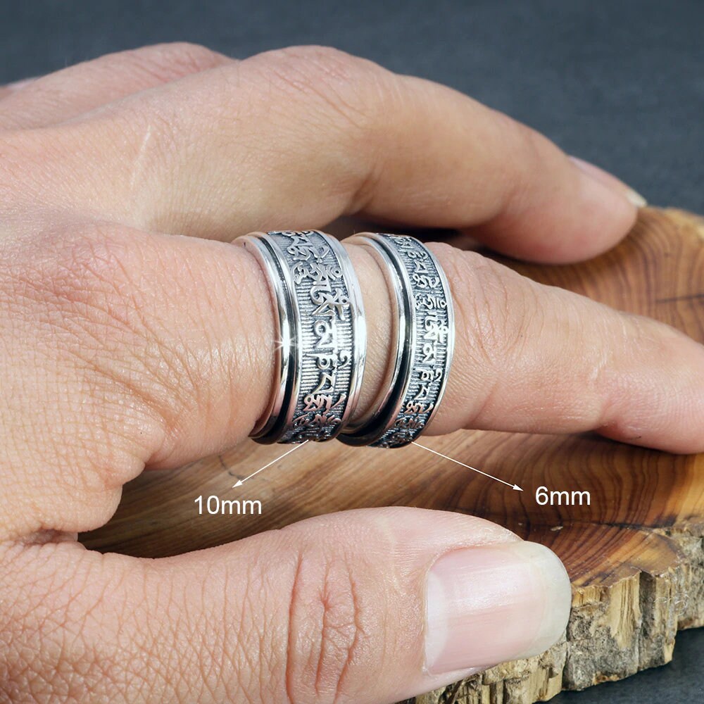 Sterling silver meditation spinner ring on hand